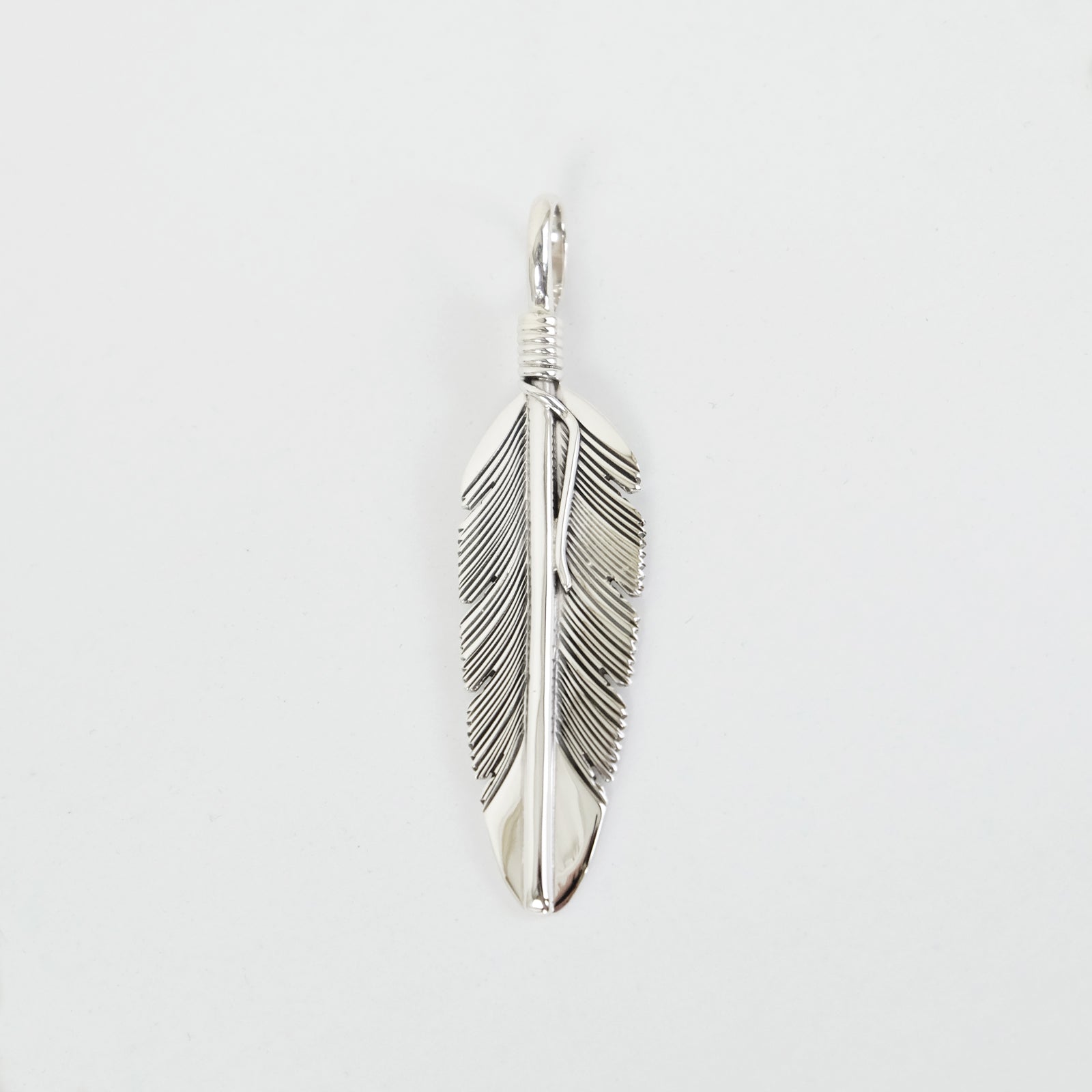 Feather pendant by Harvey Mace (silver or gold)