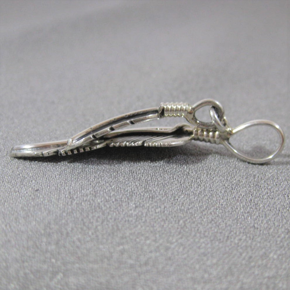Feather pendant by Harvey Mace (silver or gold)