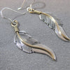 Feather earrings by Harvey Mace