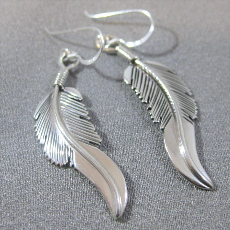 Feather earrings by Harvey Mace