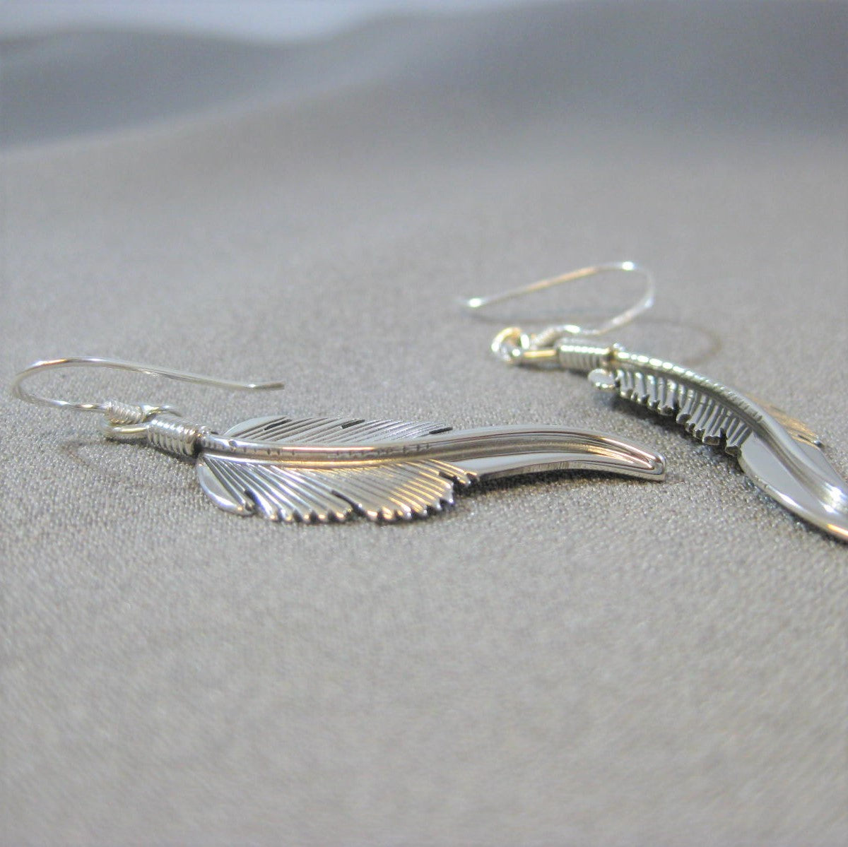 Feather earrings by Harvey Mace