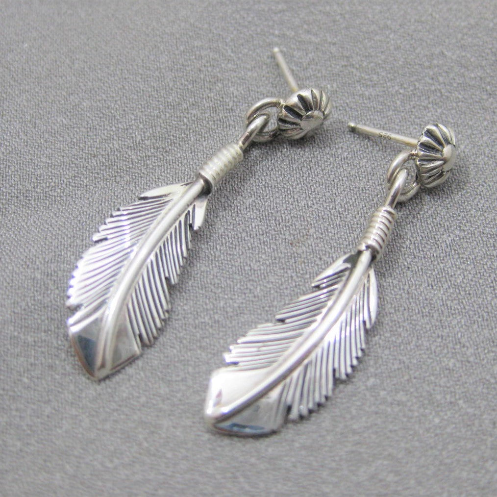 Feather earrings by Harvey Mace