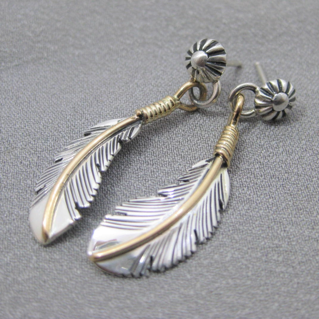 Feather earrings by Harvey Mace